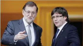  ?? Ansa ?? Sulle barricate Il premier di centro-destra Rajoy con il governator­e Puigdemont