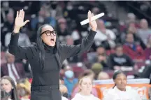  ?? SEAN RAYFORD/AP ?? South Carolina coach Dawn Staley gestures to players during the first half of a game against Clemson on Wednesday in Columbia, S.C.