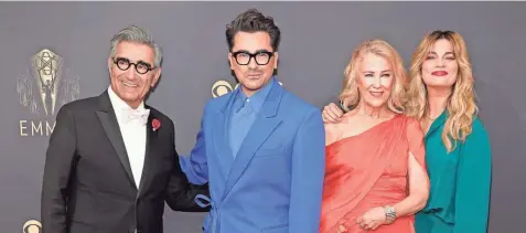  ?? CHRIS PIZZELLO/INVISION/AP ?? The cast of “Schitt’s Creek” – Eugene Levy, from left, Dan Levy, Catherine O’hara and Annie Murphy – arrives at the 73rd Primetime Emmy Awards on Sept. 19 in Los Angeles.