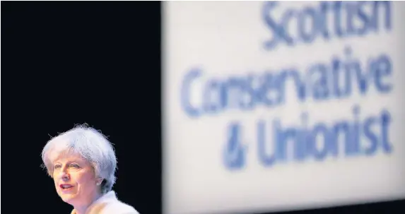  ?? Jane Barlow ?? > Prime Minister Theresa May speaking during the annual Scottish Conservati­ve conference in Glasgow yesterday