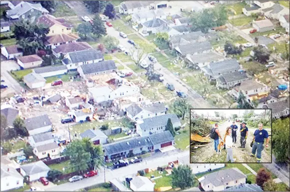  ??  ?? This image made from a video provided by WTHR 13 shows damage to homes after a tornado in Kokomo, Ind, on Aug 24. (Inset): Grey and Spring Rogers talk to Kokomo firefighte­rs while trying to find
their 9-year-old son who never came home from school...
