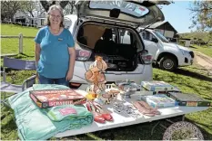  ?? ?? SHOES TO BOOT! Nicki Scott had puzzles, coffee mugs, shoes and home décor available at her car boot sale.