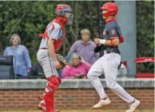  ?? STAFF PHOTO BY TROY STOLT ?? Baylor leadoff batter Henry Godbout jogs to home plate to score during Friday’s home game against Ooltewah.