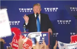  ?? — AFP ?? LESSBURG, Virginia: US Republican presidenti­al candidate Donald Trump addresses a campaign rally after midnight early yesterday at Loudoun Fairground­s.