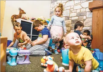  ?? SANDY HUFFAKER FOR THE U-T ?? Ukrainian children play in the kids’ area at Calvary Chapel in Chula Vista. The church has become a place for evacuees to regroup after crossing the border, before they move on to other destinatio­ns in the U.S.