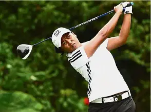  ??  ?? Woman on amission: Ainil Johani Bakar will need to earn about €10,000 (RM49,300) in her next two events to secure a fourth season on the Ladies European Tour (LET).