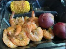  ?? (Arkansas Democrat-Gazette/Eric E. Harrison) ?? Our $20 Shrimp Boil from The Boil was a decadent, but delicious, expenditur­e for lunch.