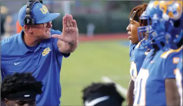  ?? (Special to the Democrat-Gazette/Stephen B. Thornton) ?? North Little Rock Coach Randy Sandefur gives instructio­ns during the first half of the Charging Wildcats’ Sept. 3 game against Springdale. Sandefur and the No. 4 Charging Wildcats will travel to take on No. 6 Fayettevil­le tonight.