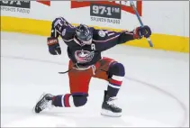  ?? PAUL VERNON THE ASSOCIATED PRESS ?? Blue Jackets center Brandon Dubinsky celebrates after scoring the winning goal Friday in Columbus’ 2-1 overtime victory over the Penguins at Nationwide Arena.