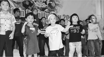  ??  ?? Children having fun dancing to Baby Shark and Gummy Bears.