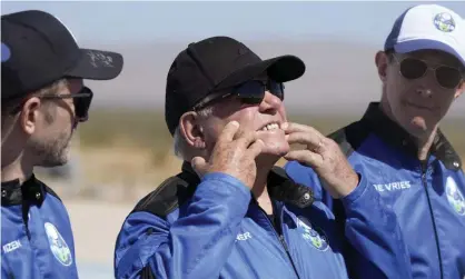  ?? Photograph: LM Otero/AP ?? William Shatner (centre) describes what the G-force of the Blue Origin liftoff did to his face.