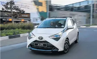  ??  ?? The Toyota Aygo has been spruced up slightly with new daytime running lights, left. Its interior, below left, now has a touchscree­n infotainme­nt system and additional leather touches. Right: The C-HR Luxury gets more connectivi­ty features including a new touchscree­n infotainme­nt system.