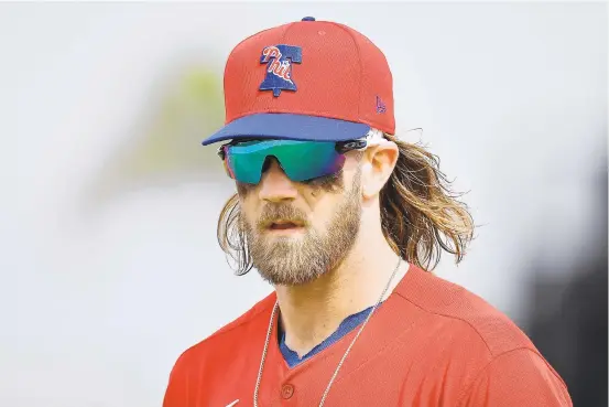  ?? MARK BROWN/GETTY ?? Last week, MLB proposed secondary cuts based on a sliding scale of income levels and totaling nearly $850 million, according to a source. For Phillies star Bryce Harper, who was due to get paid $27.5 million in 2020, his salary could be reduced to roughly $6.25 million, according to ESPN estimates.