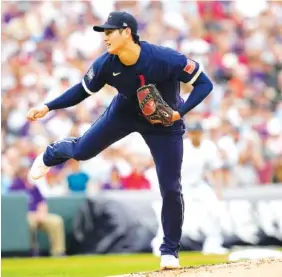  ?? AP PHOTO/DAVID ZALUBOWSKI ?? The American League’s Shohei Ohtani, of the Los Angeles Angels, pitches during the first inning of the MLB All-Star Game on Tuesday night in Denver.