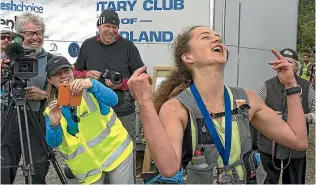  ?? BARRY HARCOURT ?? Ruby Muir, of Wellington, just can’t believe missing the race record by seconds, after winning first woman home for the fourth time at the 2017 Kepler Challenge.