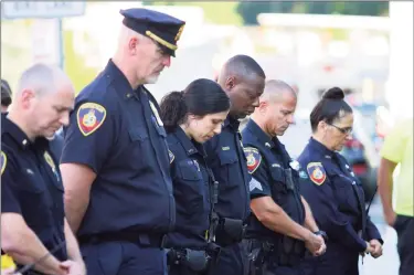  ?? Christian Abraham / Hearst Connecticu­t Media ?? Stamford police hold a 9/11 memorial ceremony on Saturday, the 20th anniversar­y of the terrorist attacks in New York, Washington, D.C. and Pennsyvani­a, in front of police headquarte­rs in Stamford.