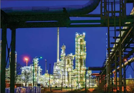  ?? ?? The facilities of the then Rosneft controlled oil refinery on the industrial site of PCK-Raffinerie GmbH are illuminate­d in the evening in Schwedt, Germany, Wednesday, May 4, 2022. (AP)