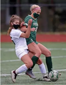  ?? MATT sTONE / HErAld sTAff filE ?? BIG GOALS: Austin Prep’s Jess Marks, left, crashes into Bishop Feehan’s Kaitryn Franchino on Oct. 12, 2020.