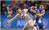  ?? — AP ?? Real Madrid’s Mateo Kovacic (left) vies for the ball with Deportivo’s Florin Andone on Wednesday.