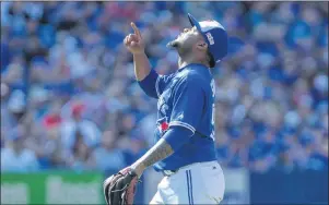  ?? CP PHOTO ?? Toronto Blue Jays relief pitcher Luis Santos reacts after striking out Detroit Tigers John Hicks to close the top of the eighth inning during Major League baseball action in Toronto on Sunday.