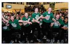  ?? KEITH COLE / CONTRIBUTE­D ?? Wright State players react after seeing their school’s name appear on the bracket during Sunday’s NCAA Tournament selection show.