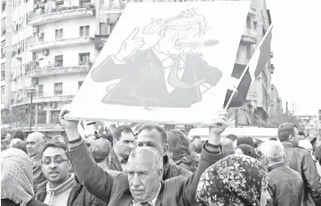  ??  ?? Syrians protest in the northern city of Aleppo against the US’ decision to recognise Israel’s sovereignt­y over the Golan Heights. — AFP photo