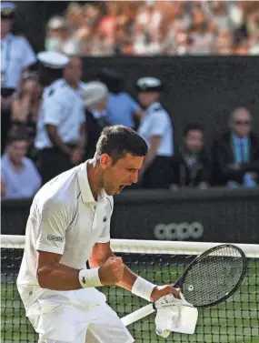  ?? SEBASTIEN BOZON/AFP VIA GETTY IMAGES ?? Novak Djokovic downed Cameron Norrie in the men's semifinals at Wimbledon on Friday.