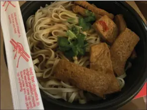  ?? (Arkansas Democrat-Gazette/Eric E. Harrison) ?? Three Fold makes its noodles — here with tofu — fresh in its kitchen.