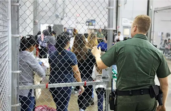  ??  ?? The Trump administra­tion’s new immigratio­n policy effectivel­y separated 2,551 families at the border. Above: Migrants at the Central Processing Center in Mcallen, Texas. Opposite: Trump signs an executive order ending the practice; deported immigrants in Guatemala.