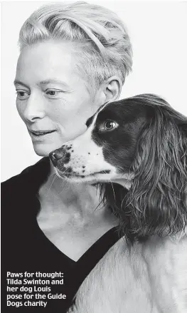  ?? ?? Paws for thought: Tilda Swinton and her dog Louis pose for the Guide Dogs charity