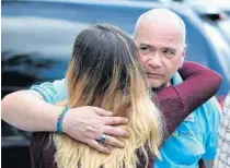  ?? JOE BURBANK/ORLANDO SENTINEL ?? Terry DeCarlo, right, a leader of the LGBTQ community, is hugged by a friend as he arrives at the scene of the Pulse nightclub shooting in 2016.