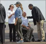  ?? SUSAN WALSH / AP ?? First lady Melania Trump greets Cecilia Abbott (left) and HUD Secretary Ben Carson (right) talks with Texas Gov. Greg Abbott in Houston. Of 12 top posts, nine are empty at Carson’s agency.