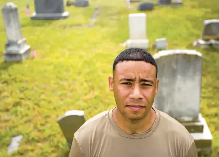  ?? BILL TIERNAN/FREELANCE PHOTOS ?? Before being transferre­d, Sgt. 1st Class Israel Lopez would lead a group of Fort Eustis soldiers who visited Elmerton and Bassett cemeteries in Hampton to cut grass, rake and clean headstones.