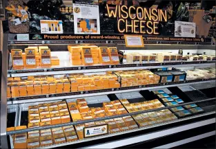  ??  ?? Simon’s Specialty Cheese is an emporium of Wisconsin products, including beer, wine, candy and, of course, cheese.