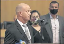  ?? ?? Sage Hopkins, San Jose State University swimming and diving head coach, speaks before being presented with a commendati­on by San Jose City Councilmem­ber Maya Esparza and San Jose Mayor Sam Liccardo.