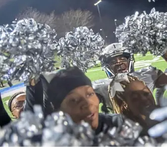  ?? Steph Chambers/Post-Gazette ?? Sto-Rox's Eric Wilson celebrates with the cheerleade­rs after beating West Greene, 24-7, in a WPIAL Class 1A semifinal game.