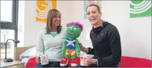  ?? Picture: PA. ?? Athletes Jessica Ennis-Hill and Eilidh Child relax with games mascot Clyde in the athletes’ village.