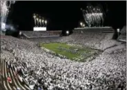  ?? CHRIS KNIGHT — THE ASSOCIATED PRESS FILE ?? The Penn State Marching Band plays on the field before an NCAA college football game between Ohio State and Penn State in State College, Pa. A day short of exactly one year since the victory against Ohio State, the Nittany Lions have another white out...