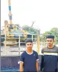  ?? PHOTO ?? Army aspirants stand in front of a T-55 tank installed outside Bapora village in Haryana’s Bhiwani district.RAHUL