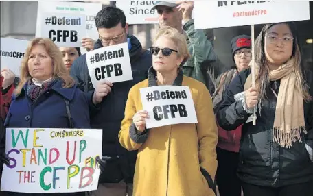  ?? Alex Wong Getty Images ?? THE CFPB’S chief has asked lawmakers to sharply reduce its authority. Above, supporters rally for the agency in Washington last year.