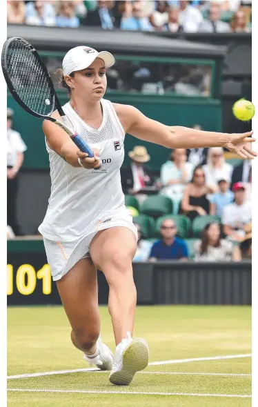 ?? Picture: AFP ?? CENTRE OF ATTENTION: Ashleigh Barty revelled in her visit to Wimbledon’s famed Centre Court, downing young English player Harriet Dart in straight sets to reach the fourth round.
