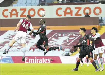  ?? (Photo: AFP) ?? Liverpool’s Senegalese striker Sadio Mane (second left) beats Aston Villa’s English defender Jake Walker to scores his team’s third goal during the English FA Cup third round football match at Villa Park in Birmingham, central England yesterday.