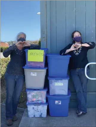  ?? MCCF — CONTRIBUTE­D ?? MCCF volunteers, Pam Huntley (left) and Tania Miller, (right) help fold and pack MCCF back-to-school clothes for all coast school district students.