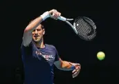  ?? Darrian Traynor / Getty Images ?? Novak Djokovic practiced at the Australian Open’s main court while his visa status is being debated.