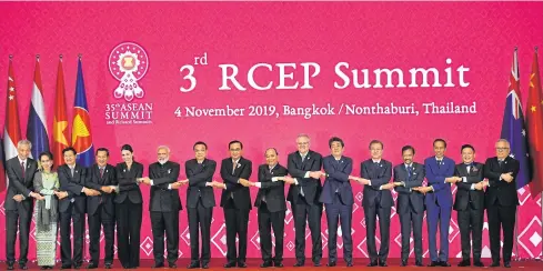  ?? AFP ?? Leaders take a group photo during the 3rd RCEP Summit in Bangkok on the sidelines of this month’s 35th Asean Summit.