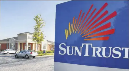  ?? JOHN SPINK / JSPINK@AJC.COM ?? The SunTrust investigat­ion centers on whether the bank’s investment arm bought costly mutual funds on behalf of clients that charged a type of marketing fee.