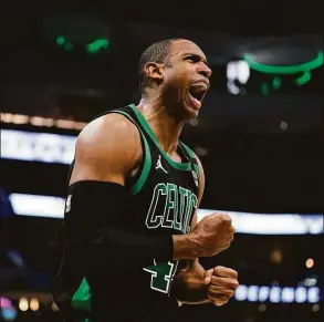  ?? Morry Gash / Associated Press ?? The Celtics’ Al Horford reacts during the second half of Game 4 at Milwaukee on Monday. Horford scored 30 points in a 116-108 win.