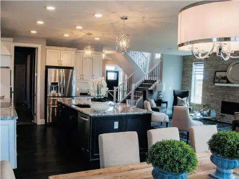  ?? Dylan Thompson/Edmonton Journal ?? An open-concept design connects the living room, kitchen and dining room in Crystal Creek’s Kingston home.