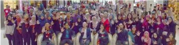  ??  ?? (seated from left) Mohammad Akhmal, Jamali Bujang Sanawi, Leovell Sam Avenido, Khadijah Mohammad Tuah with organising team members showing the hand sign “Stop” to indicate the seriousnes­s of sexual harassment.