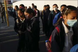  ?? ARIANA CUBILLOS — THE ASSOCIATED PRESS ?? Children line up to enter their classrooms in Caracas, Venezuela, on Feb. 27.